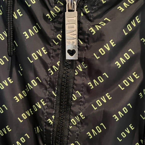 Love Love Love black windbreaker with yellow/green print.  Full zip with hood - Picture 3 of 4